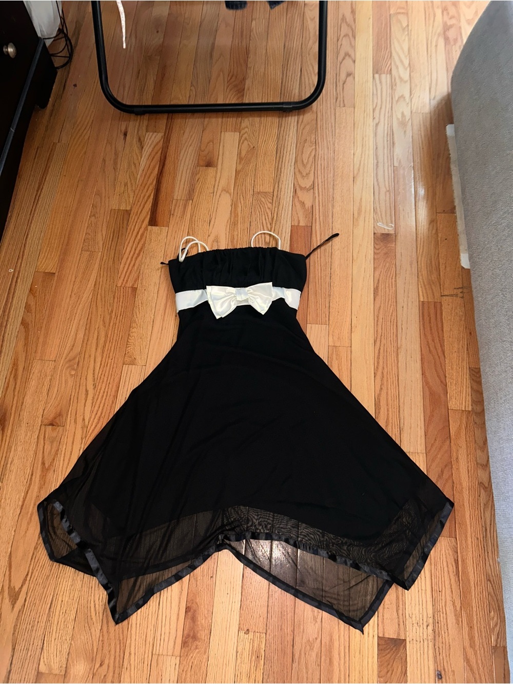 Star Vixen Black Dress with White Bow Accent